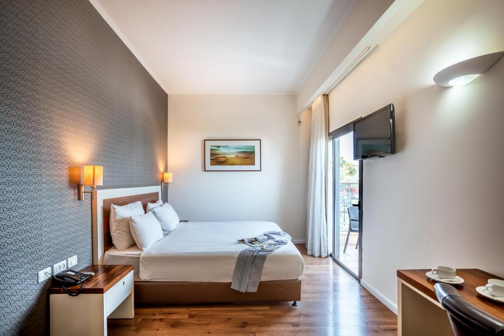 TV a/nebo společenská místnost v ubytování Emily's Hotel