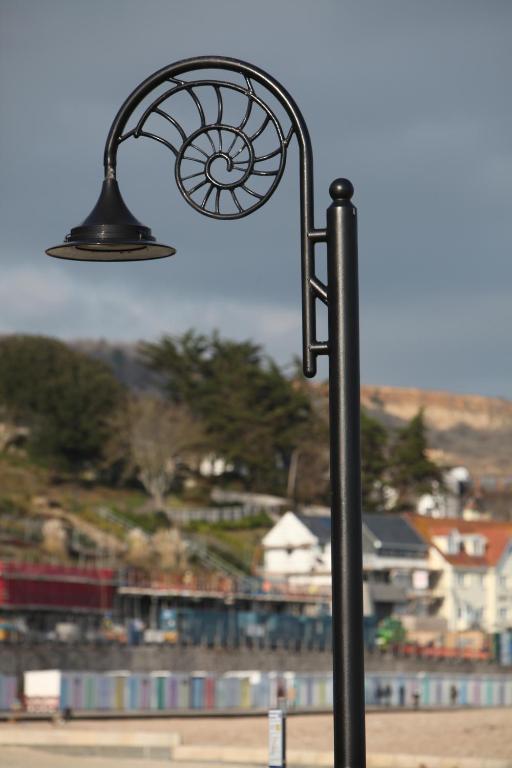 a black street light with a view of a city at Fernhill Hotel in Lyme Regis