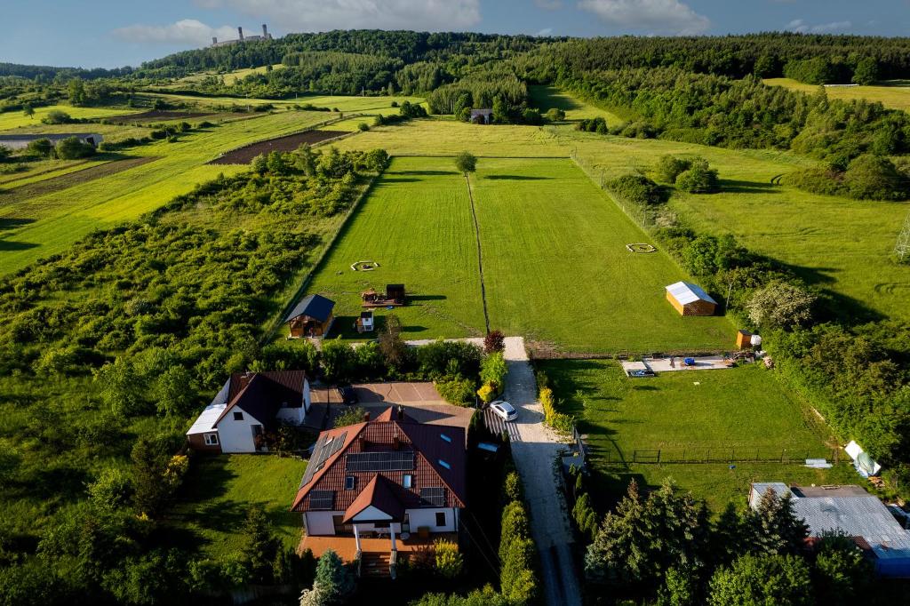 an aerial view of a house in the middle of a field at Agroturystyka ''Relax'' in Chęciny
