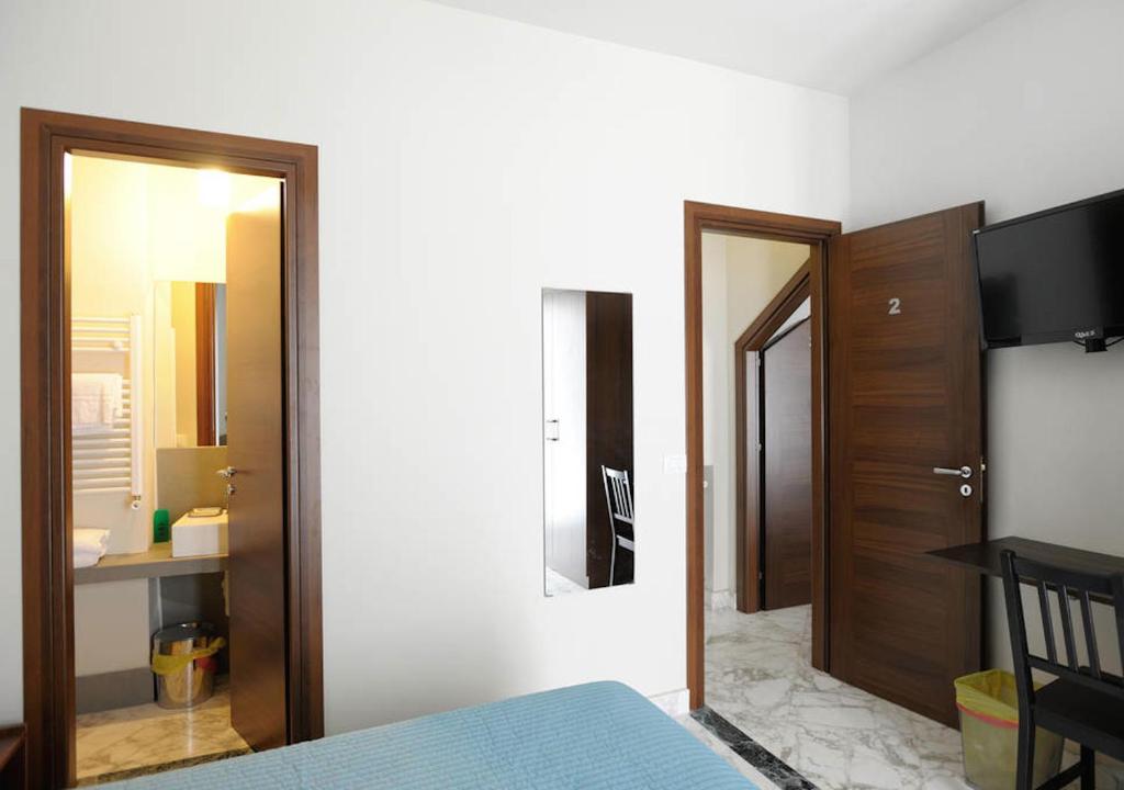 Posteľ alebo postele v izbe v ubytovaní B&B Le Vie D'Arte