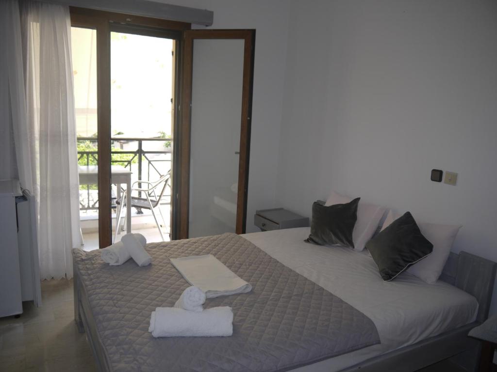 Postel nebo postele na pokoji v ubytování Hotel Akropolis