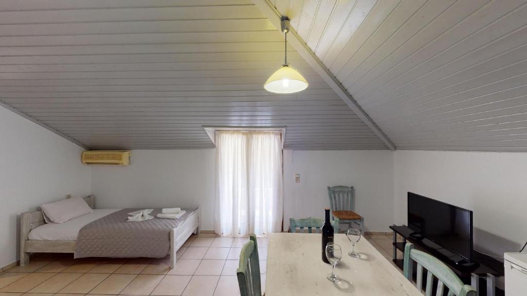 Postel nebo postele na pokoji v ubytování Hotel Akropolis