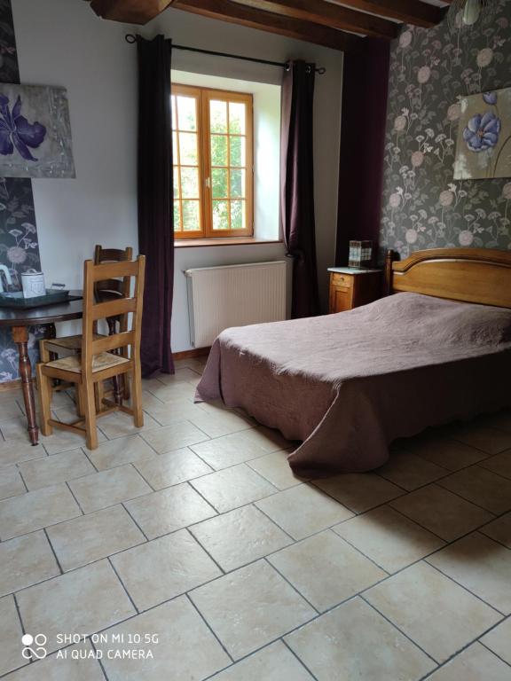 Postel nebo postele na pokoji v ubytování Chambre de pouligny