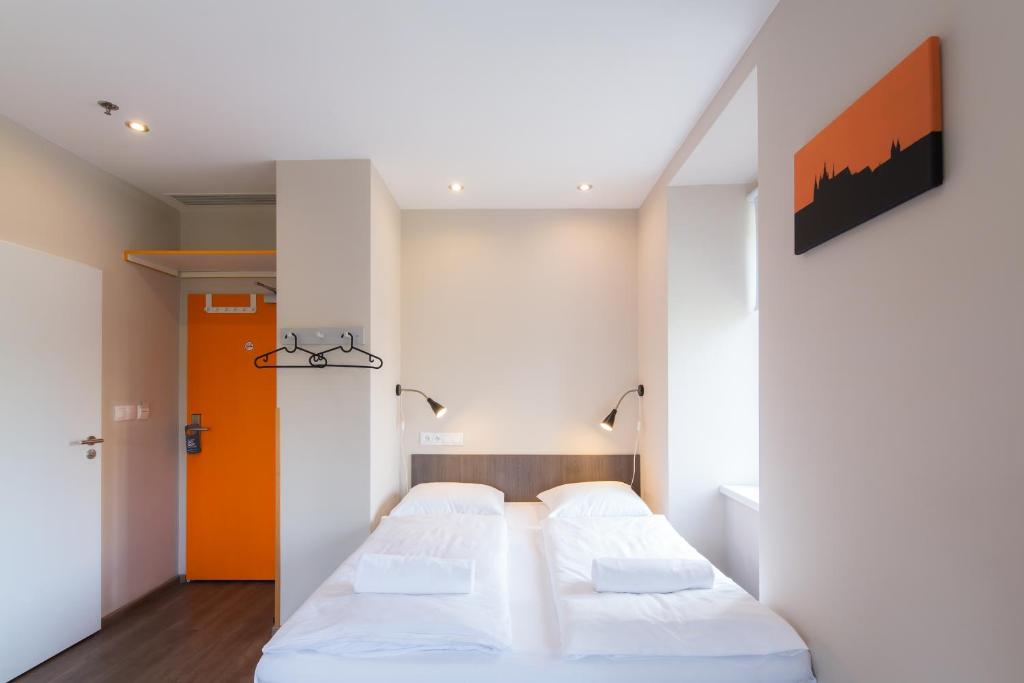 Postel nebo postele na pokoji v ubytování Minimino hotel