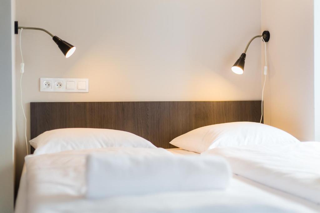 Postel nebo postele na pokoji v ubytování Minimino hotel
