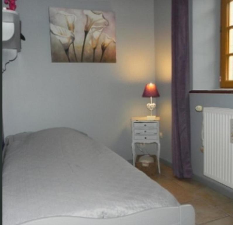 Postel nebo postele na pokoji v ubytování Chambre de pouligny