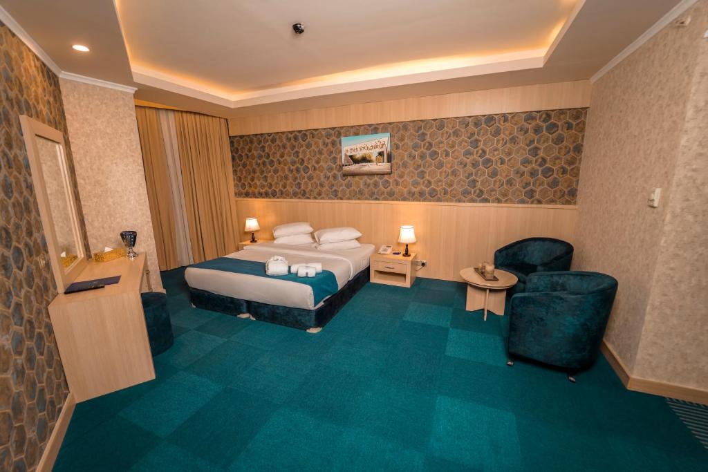 Postel nebo postele na pokoji v ubytování Sipan Hotel