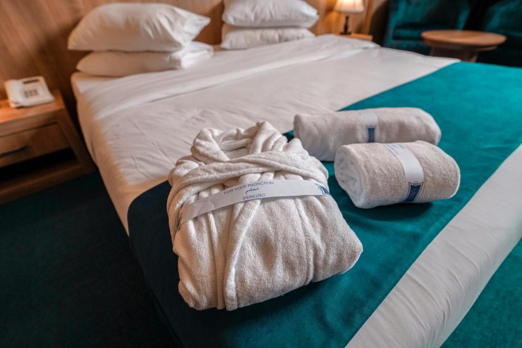 Postel nebo postele na pokoji v ubytování Sipan Hotel