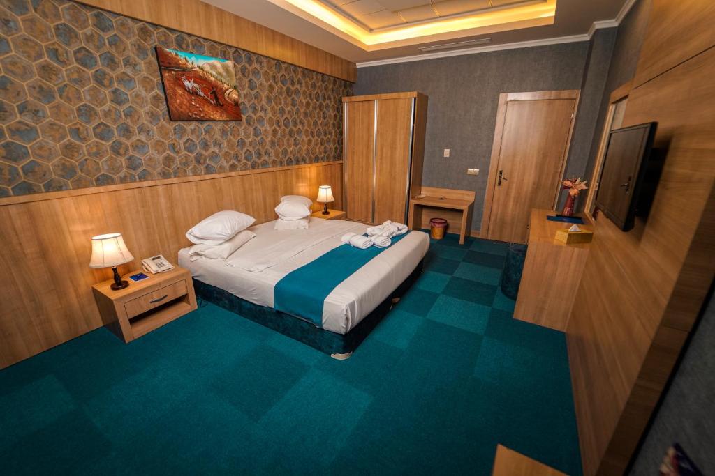 Postel nebo postele na pokoji v ubytování Sipan Hotel