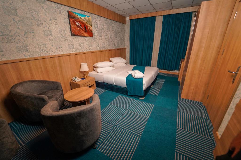 Postel nebo postele na pokoji v ubytování Sipan Hotel