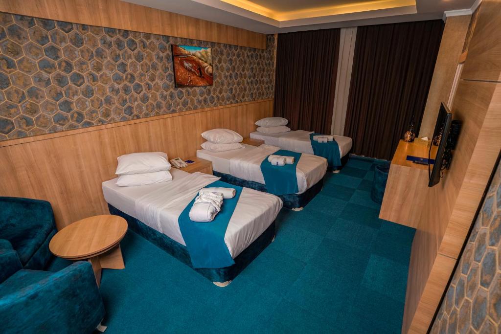 Postel nebo postele na pokoji v ubytování Sipan Hotel