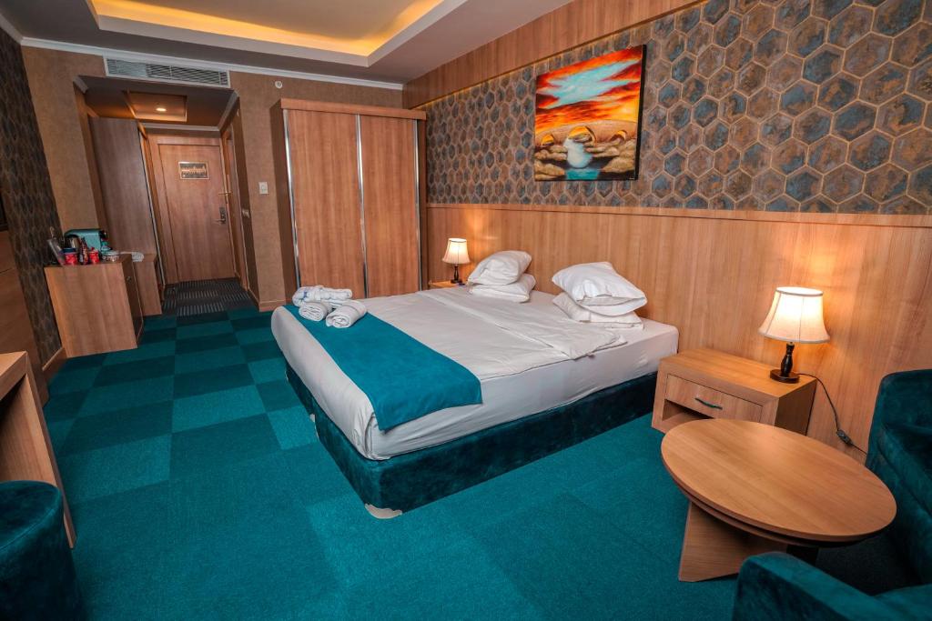 Postel nebo postele na pokoji v ubytování Sipan Hotel