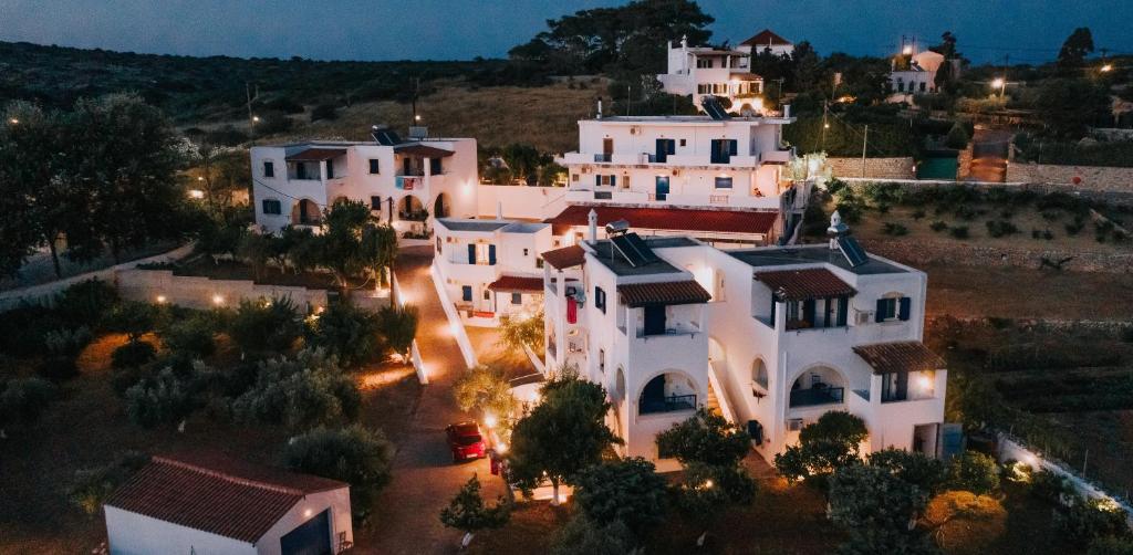 an aerial view of a white house at night at Theofilos Appartements in Livadi