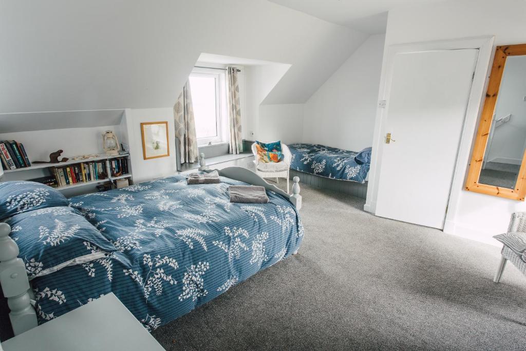 Postel nebo postele na pokoji v ubytování Whitewave Apartment