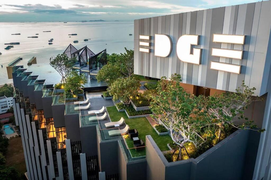 an overhead view of a building with chairs and trees at EDGE Central pattaya near walking street in Pattaya Central