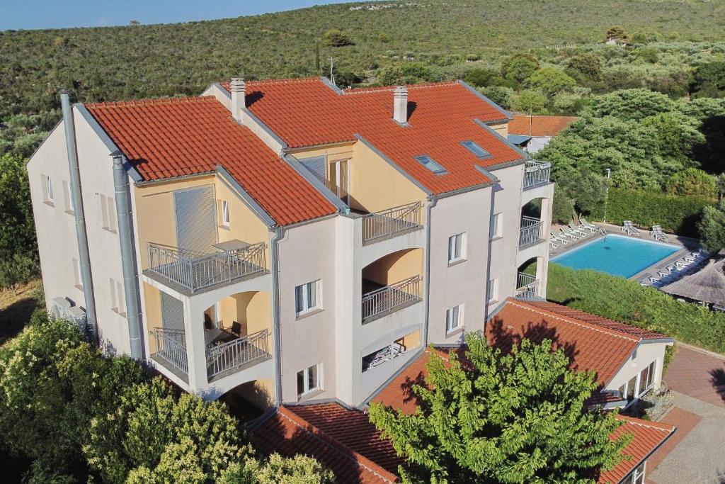 an aerial view of a house with a swimming pool at Villa Tade in Debeljak