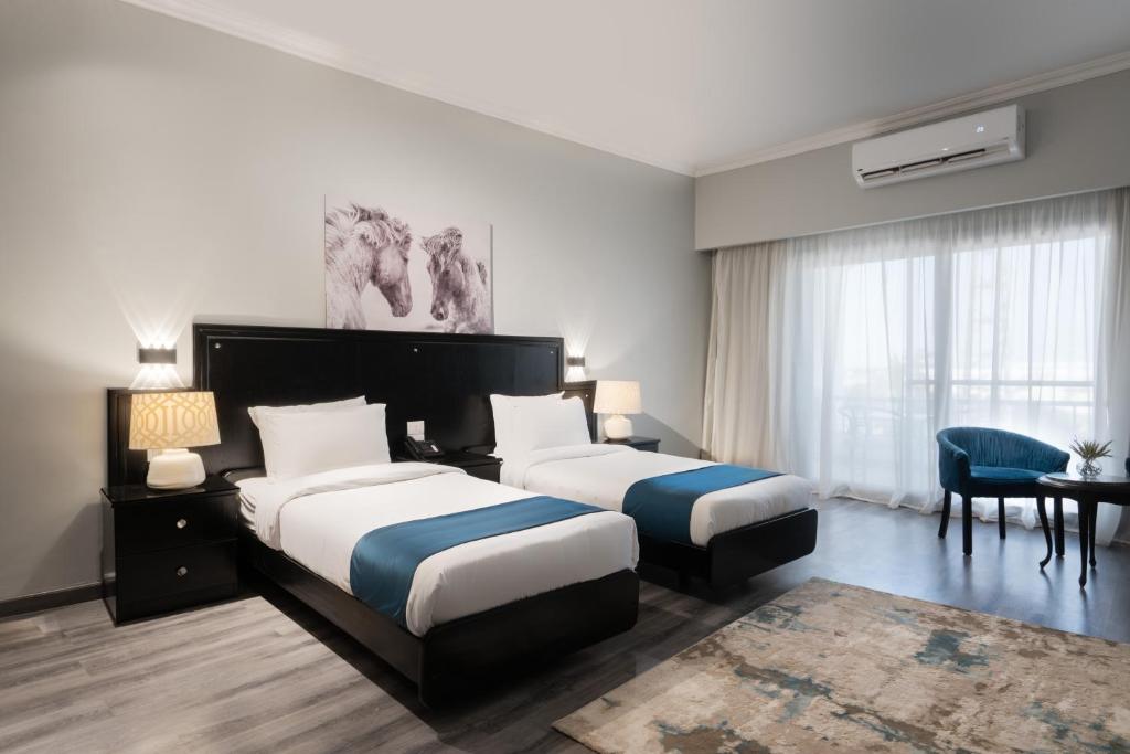 Кровать или кровати в номере Assiut Cement Hotel
