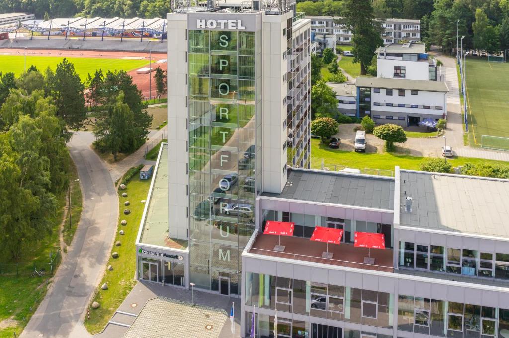 an aerial view of a building with a hotel at Hotel Sportforum in Rostock