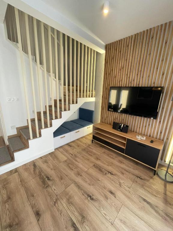 Televízia a/alebo spoločenská miestnosť v ubytovaní Norda Resort
