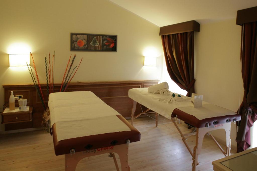 Postel nebo postele na pokoji v ubytování Hotel Valentino