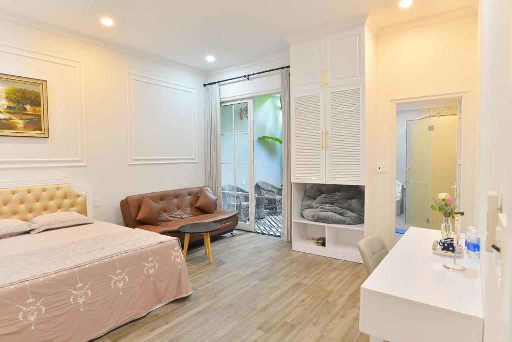 Postel nebo postele na pokoji v ubytování La villa de CoCo Bến Tre