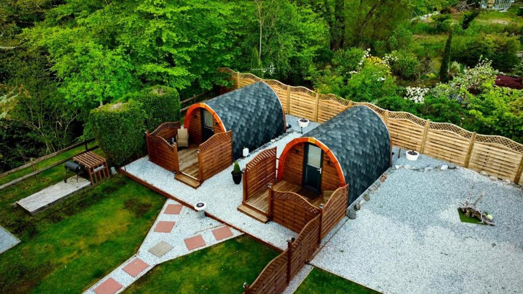 an aerial view of a garden with three iguana houses at Highland & Transylvania Glamping Pods in Roybridge