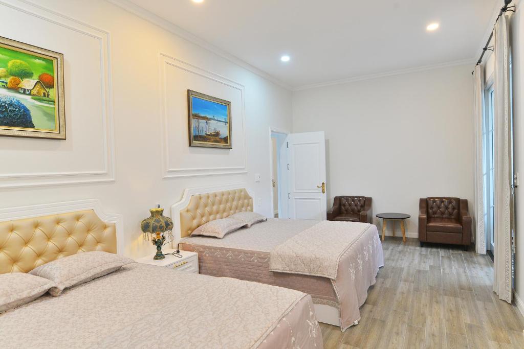 Postel nebo postele na pokoji v ubytování La villa de CoCo Bến Tre