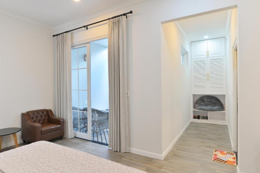 Postel nebo postele na pokoji v ubytování La villa de CoCo Bến Tre