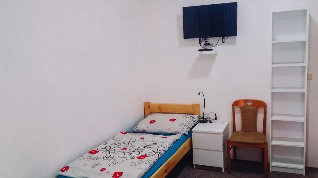 Postel nebo postele na pokoji v ubytování Penzion u Karla