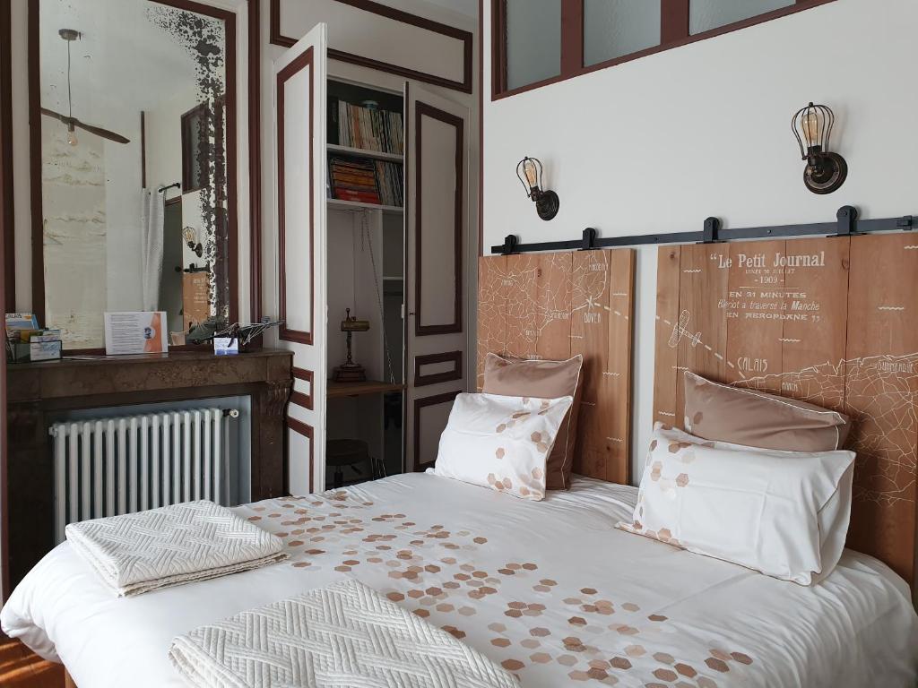 Кровать или кровати в номере B & B Les Secrets des Loges