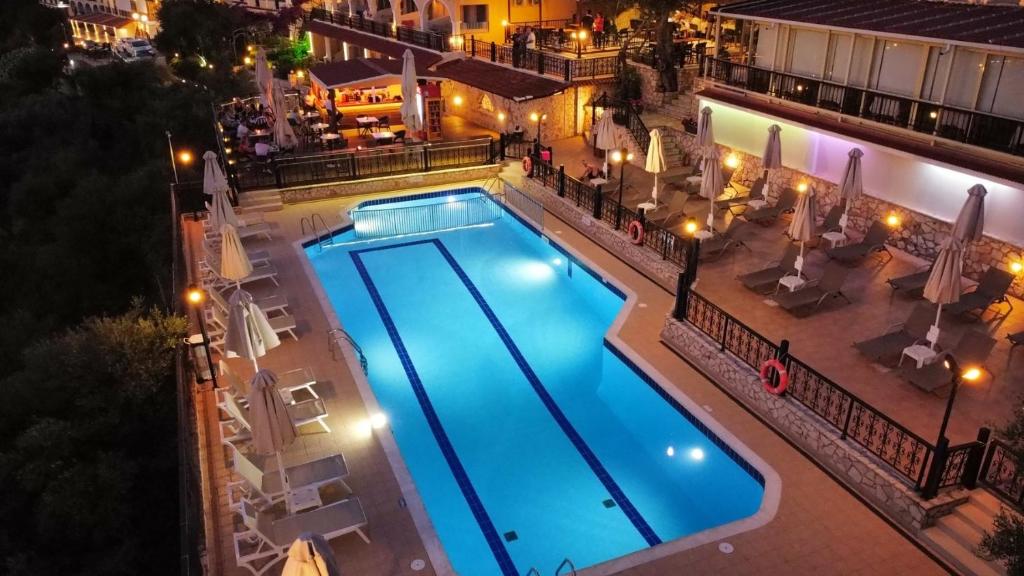 an overhead view of a swimming pool at night at Zante Palace in Tsilivi