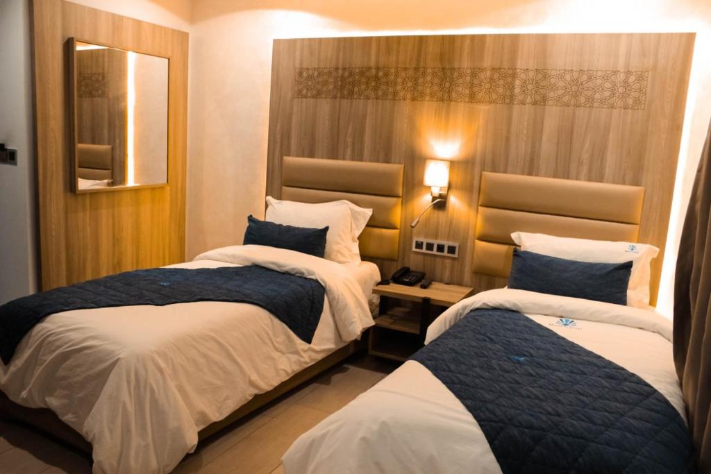 Postel nebo postele na pokoji v ubytování Hôtel La Perla