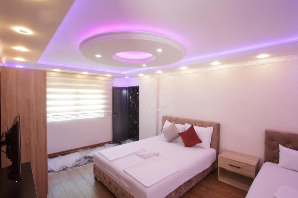 Postel nebo postele na pokoji v ubytování B H B Apartmani