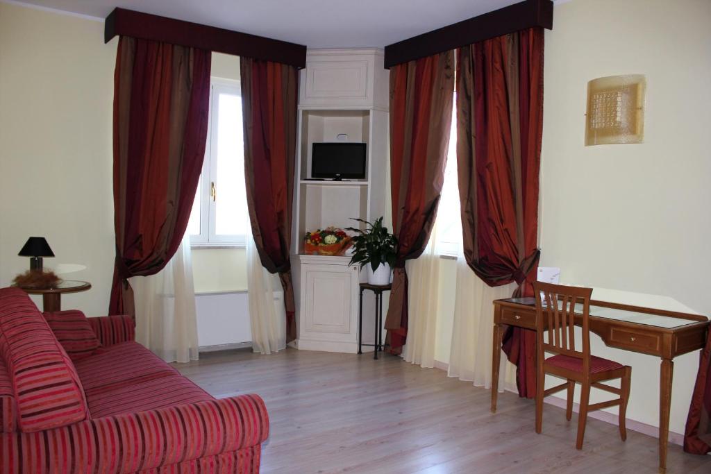 TV a/nebo společenská místnost v ubytování Hotel Valentino