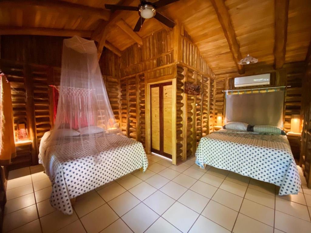 Postel nebo postele na pokoji v ubytování Cabañas Lamaite