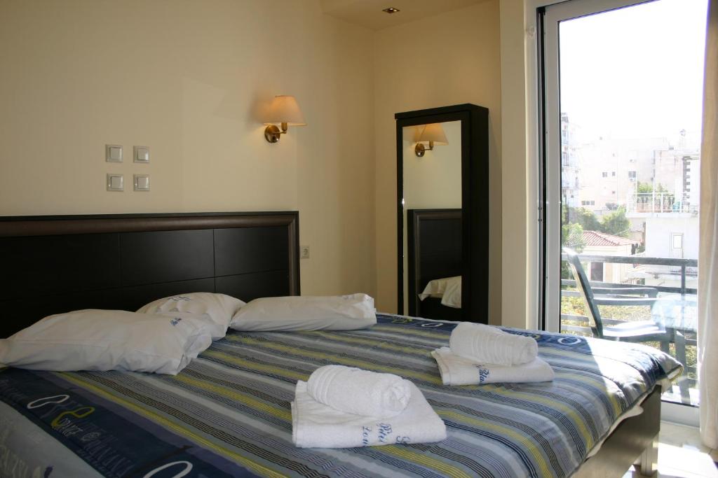 Postel nebo postele na pokoji v ubytování Petit Palais Hotel