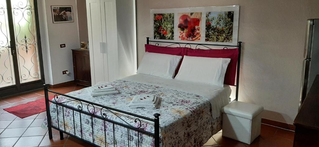 Ліжко або ліжка в номері La Collina del Melograno