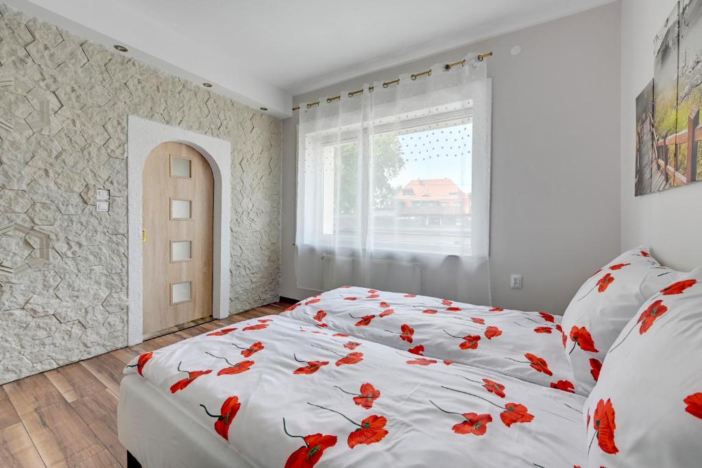 Postel nebo postele na pokoji v ubytování Oliwa House by Platinium Lofts