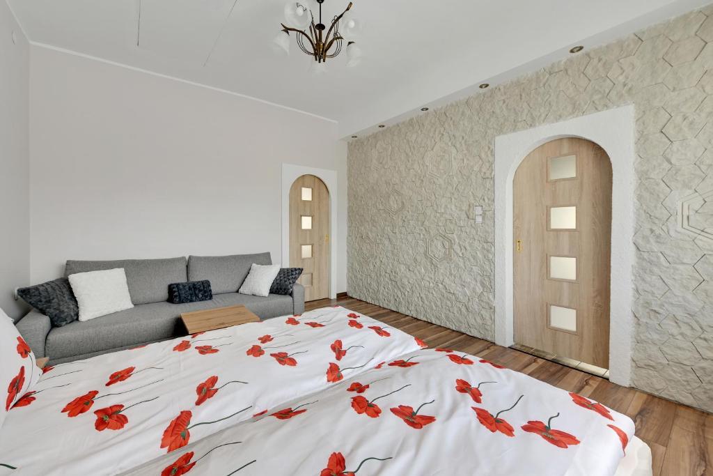 Postel nebo postele na pokoji v ubytování Oliwa House by Platinium Lofts
