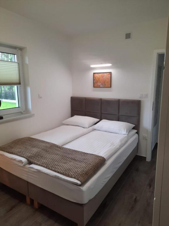 Posteľ alebo postele v izbe v ubytovaní APARTAMENTY LAS Zator