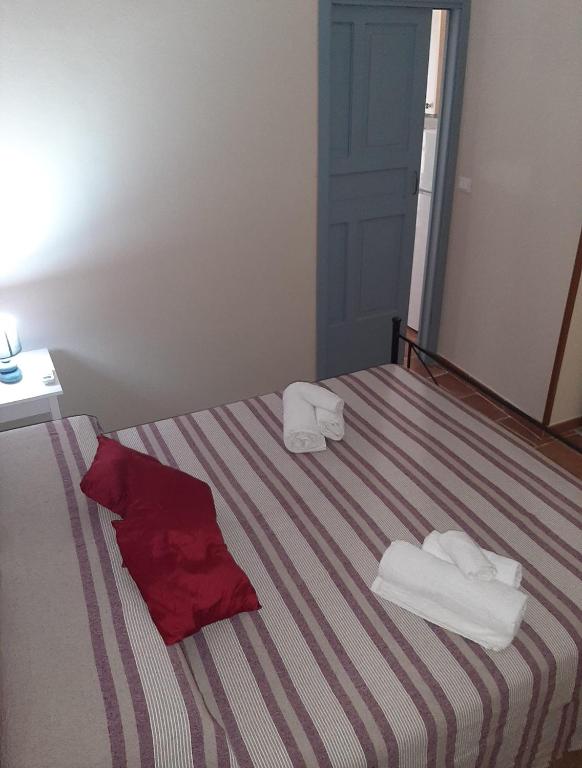 Posteľ alebo postele v izbe v ubytovaní CASA VACANZA DI VIA GIACALONE
