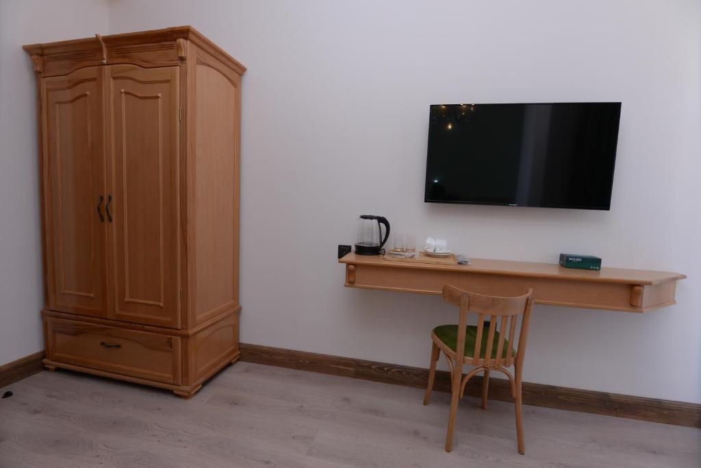 TV a/nebo společenská místnost v ubytování Old Avenue Hotel