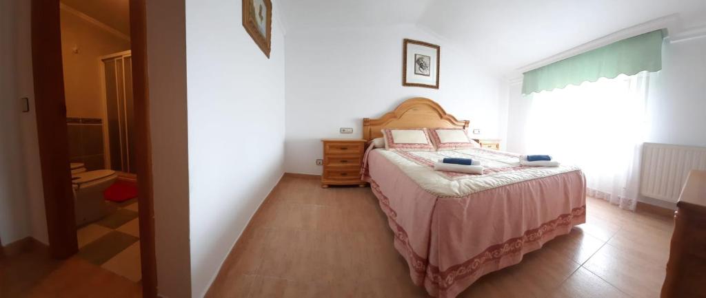 Postel nebo postele na pokoji v ubytování La Morada del Tejar