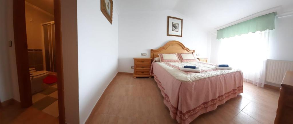 A bed or beds in a room at La Morada del Tejar