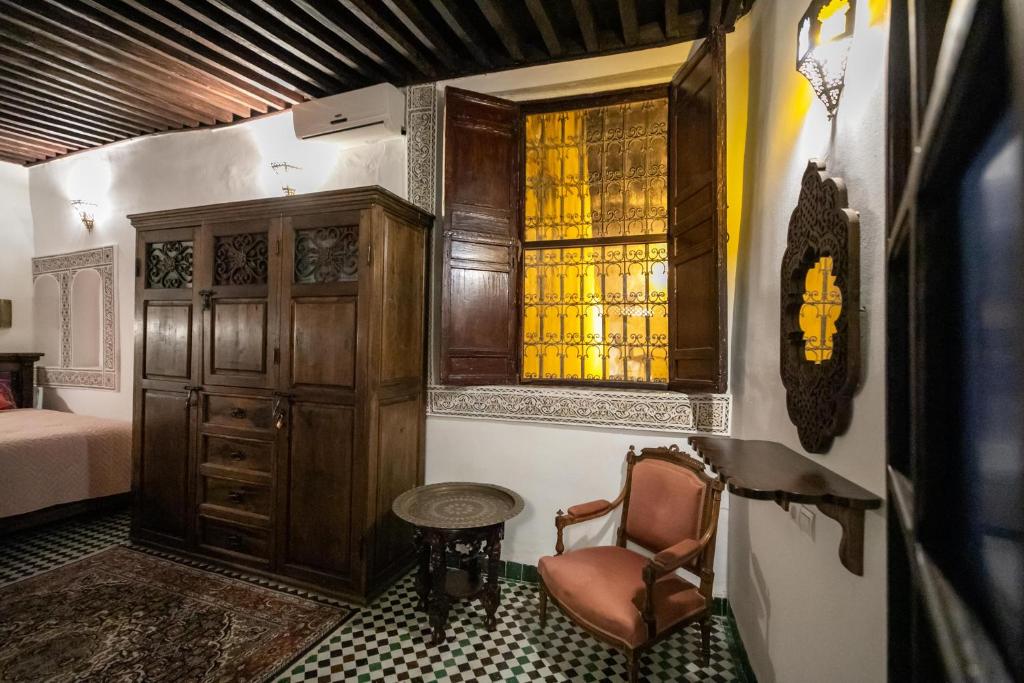 Postel nebo postele na pokoji v ubytování Dar Chez Khadija