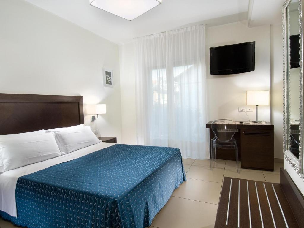 Postel nebo postele na pokoji v ubytování Hotel La Cappuccina