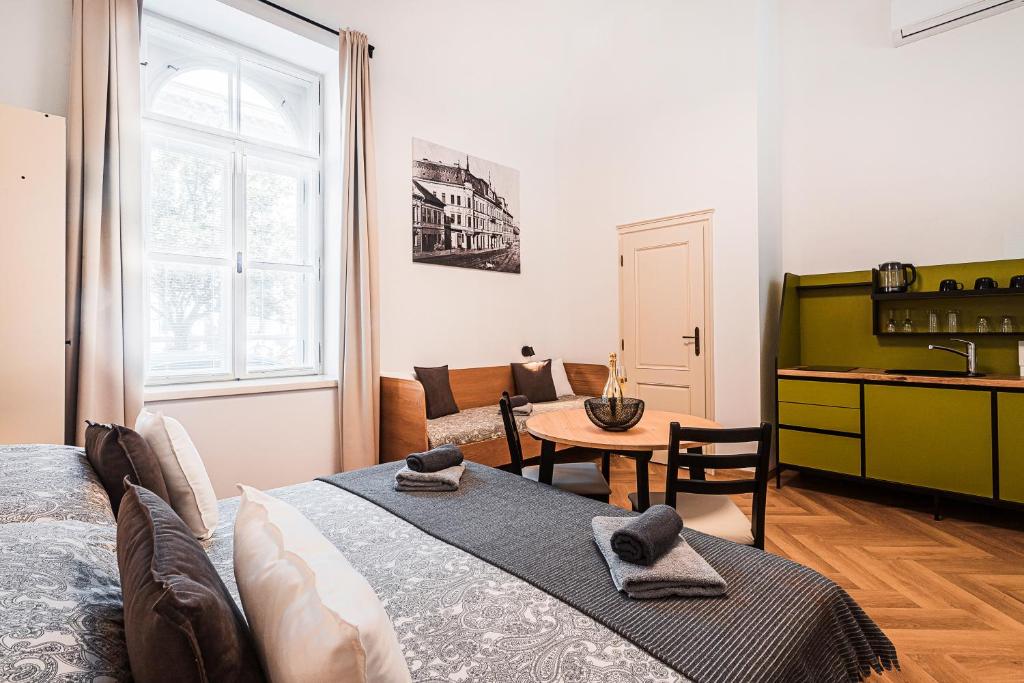 Postel nebo postele na pokoji v ubytování Apartmány Krmanova