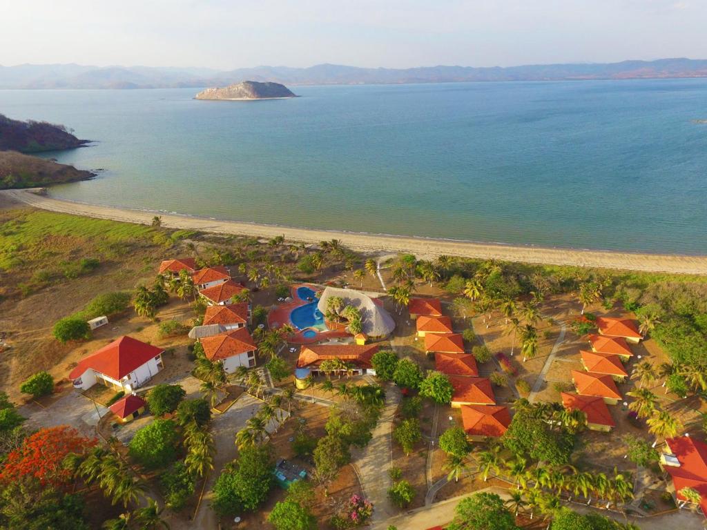 an aerial view of a resort next to the ocean at Nandel Beach Resort in La Cruz