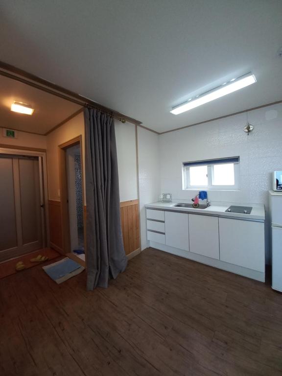 Kuchyň nebo kuchyňský kout v ubytování Good Day Pension