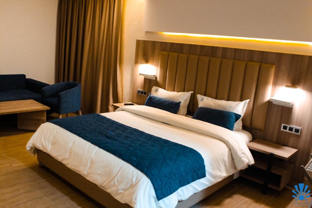 Postel nebo postele na pokoji v ubytování Hôtel La Perla